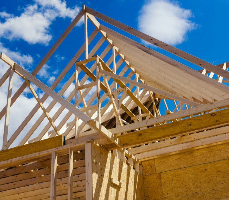 Wooden beams at construction the roof truss system house